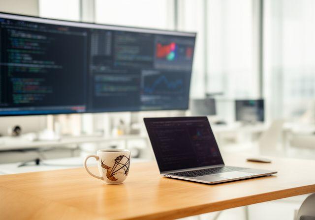 Collaborative modern workspace with screens and data visualizations